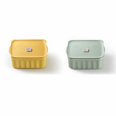 Two square containers, one yellow and one green, on a white background